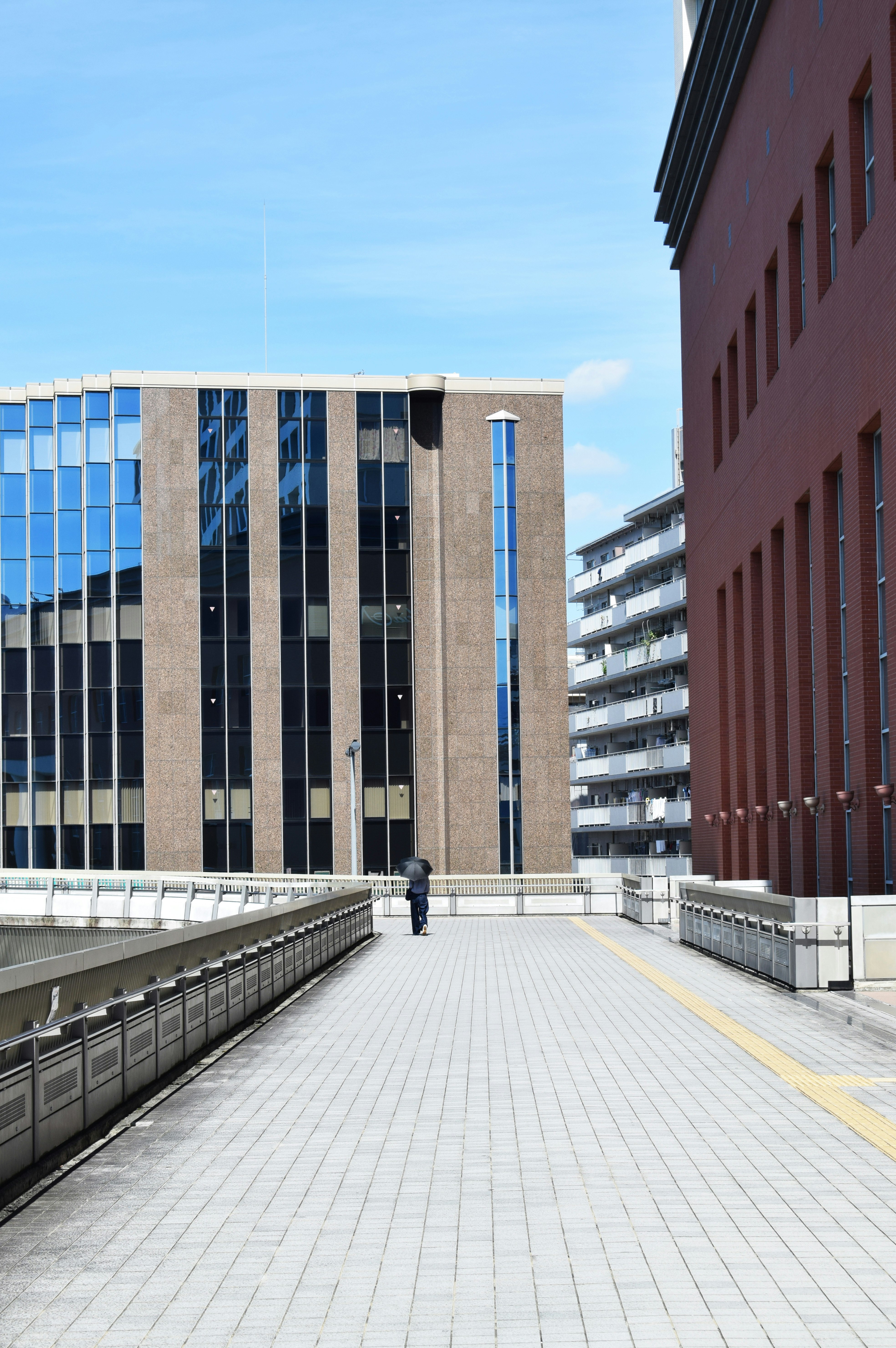 pathway beside buildings at day time